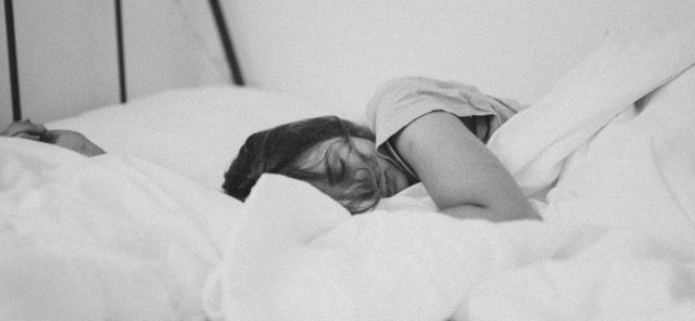 Sleep Apnea. Woman sleeping in a bed.