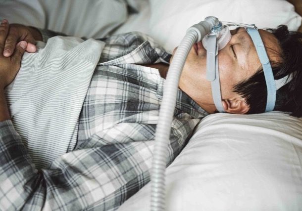 Sleep Services. Man with CPAP.